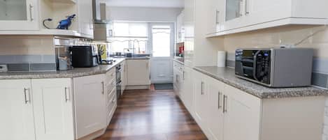 Fridge, electric kettle, toaster, cookware/dishes/utensils