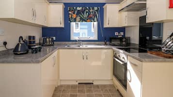 Fridge, microwave, toaster, cookware/dishes/utensils
