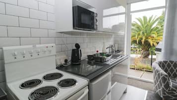 Fridge, electric kettle, toaster, cookware/dishes/utensils