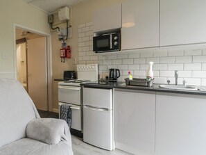 Fridge, electric kettle, toaster, cookware/dishes/utensils