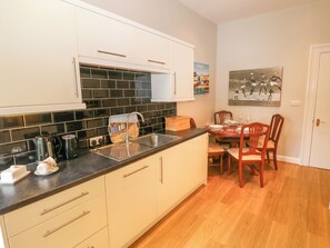 Fridge, dishwasher, electric kettle, cookware/dishes/utensils
