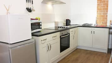 Fridge, electric kettle, cookware/dishes/utensils