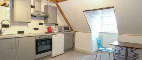 Fridge, electric kettle, toaster, cookware/dishes/utensils