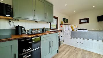 Fridge, electric kettle, toaster, cookware/dishes/utensils