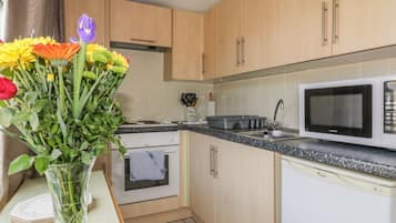 Fridge, electric kettle, cookware/dishes/utensils