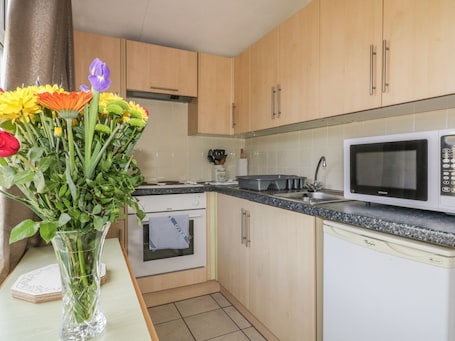 Fridge, electric kettle, cookware/dishes/utensils