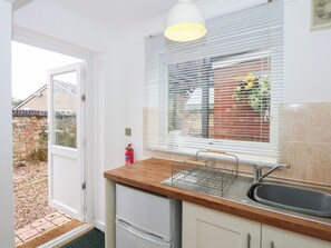 Fridge, electric kettle, cookware/dishes/utensils
