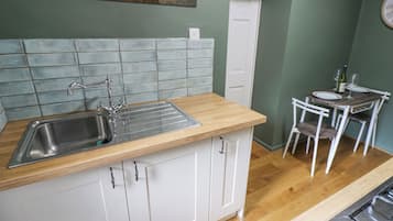 Fridge, electric kettle, toaster, cookware/dishes/utensils