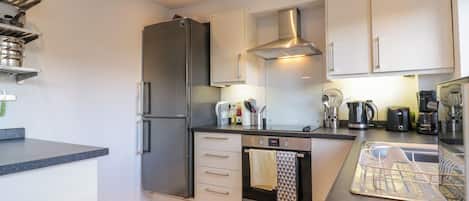 Fridge, electric kettle, toaster, cookware/dishes/utensils