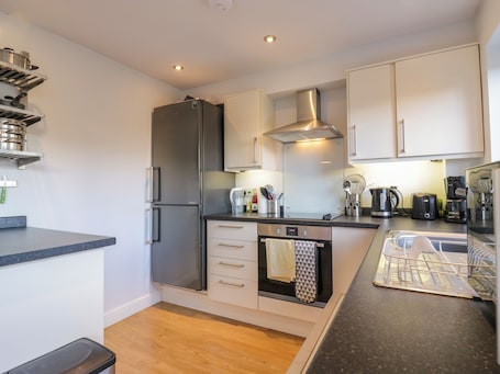 Fridge, electric kettle, toaster, cookware/dishes/utensils