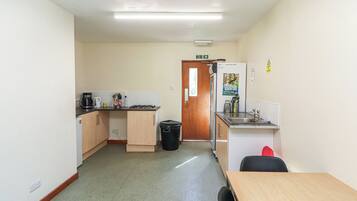 Fridge, electric kettle, cookware/dishes/utensils