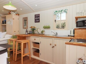 Fridge, electric kettle, cookware/dishes/utensils