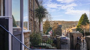 A stone building with a balcony, a street view, and a 'Give Way' sign. - 5 Hamilton Terrace (Harrogate)