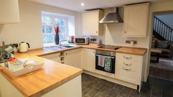 Fridge, electric kettle, toaster, cookware/dishes/utensils