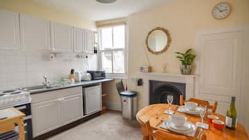 Fridge, electric kettle, toaster, cookware/dishes/utensils
