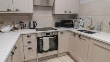 Fridge, electric kettle, cookware/dishes/utensils