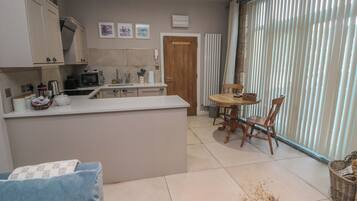 Fridge, electric kettle, cookware/dishes/utensils