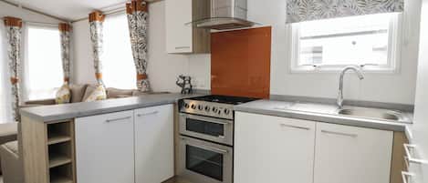 Fridge, electric kettle, toaster, cookware/dishes/utensils
