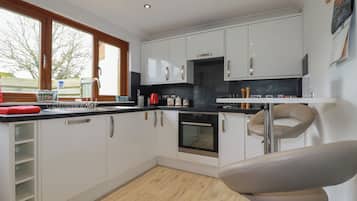 Fridge, dishwasher, electric kettle, cookware/dishes/utensils