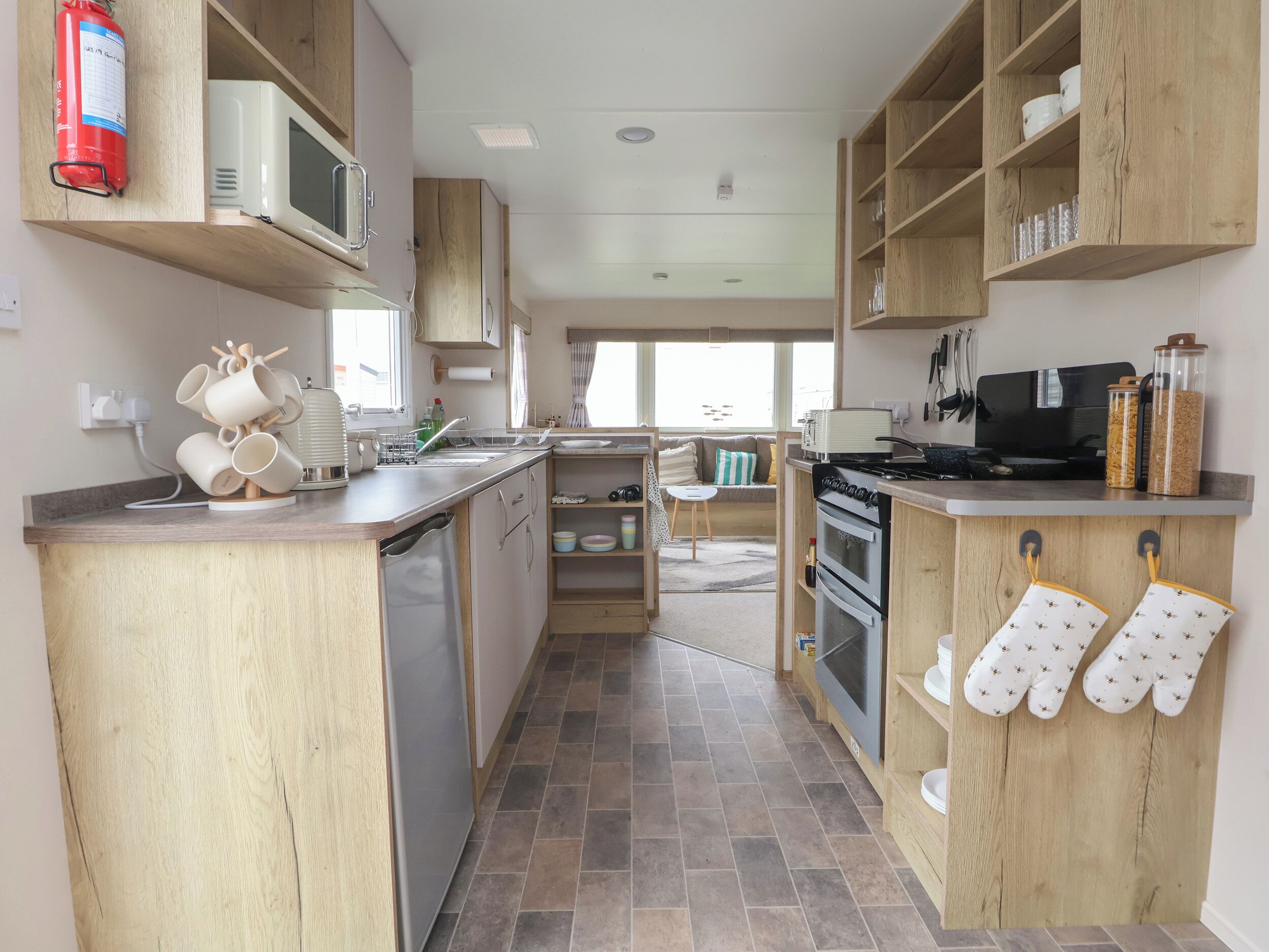 Fridge, electric kettle, toaster, cookware/dishes/utensils