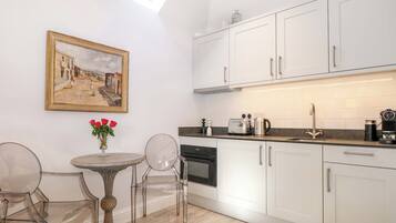 Fridge, electric kettle, toaster, cookware/dishes/utensils