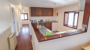 Fridge, dishwasher, electric kettle, cookware/dishes/utensils