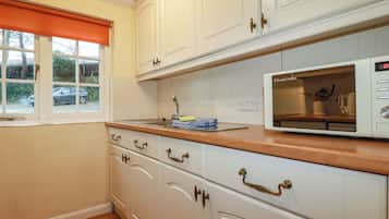 Fridge, electric kettle, toaster, cookware/dishes/utensils