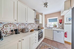 Cottage | Private kitchen | Dishwasher, cookware/dishes/utensils - Bodior Lodge (Holyhead)