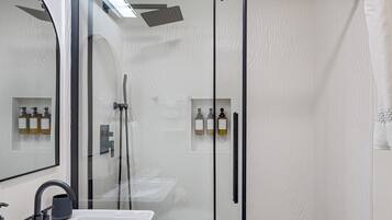 Shower, hair dryer, towels, soap