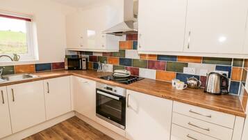 Fridge, dishwasher, electric kettle, cookware/dishes/utensils