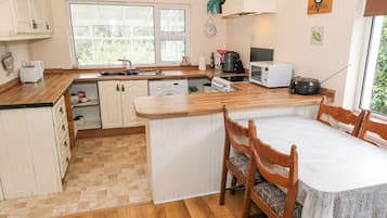 Fridge, electric kettle, toaster, cookware/dishes/utensils