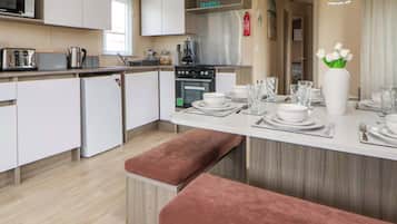 Fridge, electric kettle, toaster, cookware/dishes/utensils