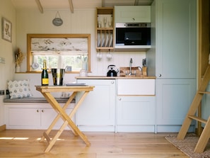 Fridge, electric kettle, toaster, cookware/dishes/utensils