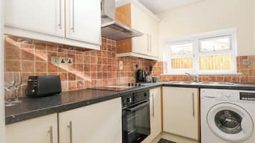 Fridge, electric kettle, toaster, cookware/dishes/utensils