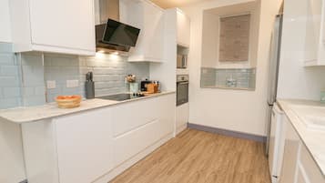 Fridge, dishwasher, electric kettle, cookware/dishes/utensils