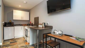 Fridge, electric kettle, toaster, cookware/dishes/utensils