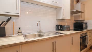 Fridge, electric kettle, cookware/dishes/utensils