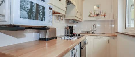 Fridge, electric kettle, toaster, cookware/dishes/utensils