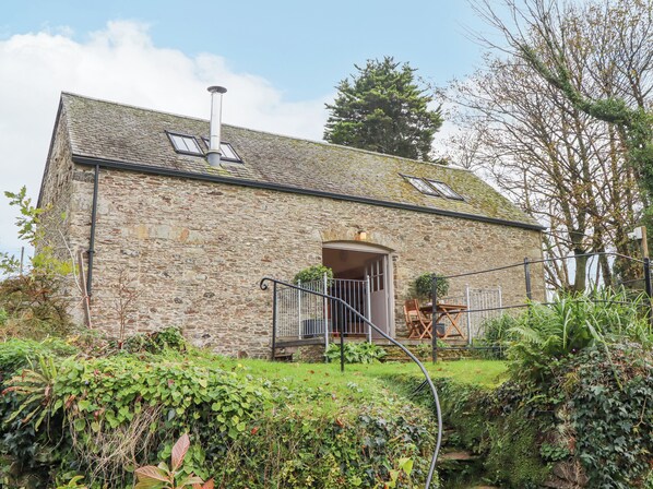 A stone building with a small porch and a chimney. - The Barn at Yeoland House (Yelverton)