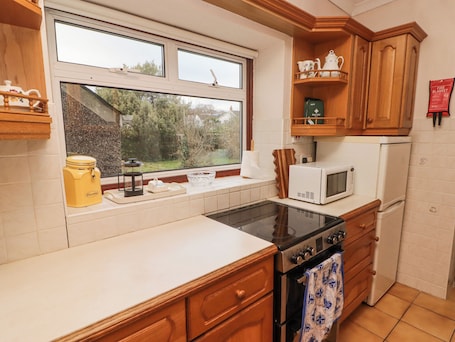 Fridge, electric kettle, cookware/dishes/utensils