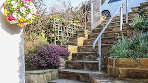 A stone staircase leading up to a vehicle parked on a driveway. - Trackside (Whitby)