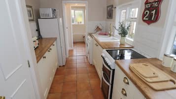 Fridge, electric kettle, toaster, cookware/dishes/utensils