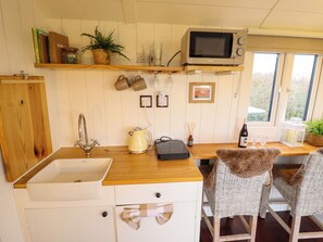 Fridge, electric kettle, toaster, cookware/dishes/utensils