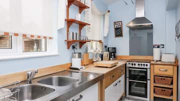 Fridge, electric kettle, toaster, cookware/dishes/utensils