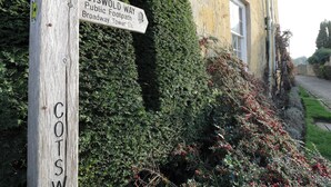 A wooden signpost with 'COTSWOLD WAY' and 'Broadway Tower' directions. - Tree Tops (Broadway)