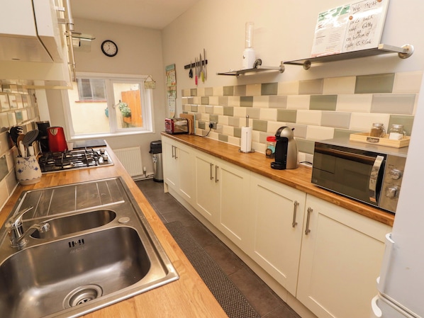 Fridge, electric kettle, toaster, cookware/dishes/utensils