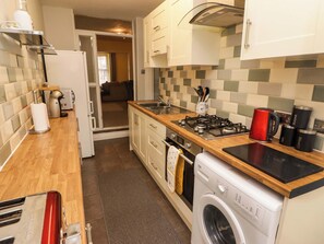 Fridge, electric kettle, toaster, cookware/dishes/utensils