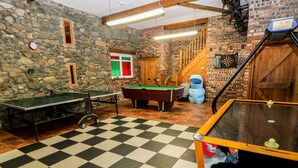 A room with a pool table, a ping pong table, and a billiards table. - Y Bwthyn (Pwllheli)