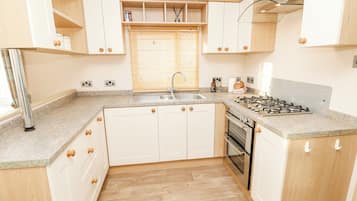 Fridge, electric kettle, toaster, cookware/dishes/utensils