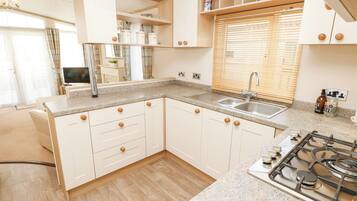 Fridge, electric kettle, toaster, cookware/dishes/utensils